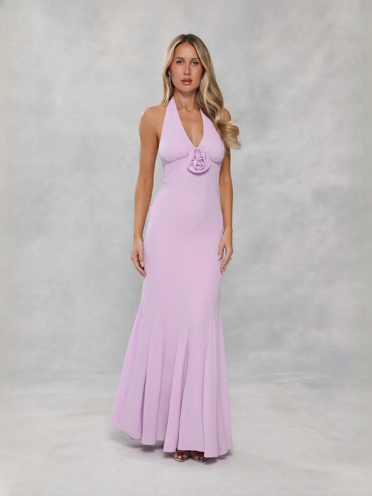 Lavender halter neck prom dress with rosette detail and flared mermaid hem