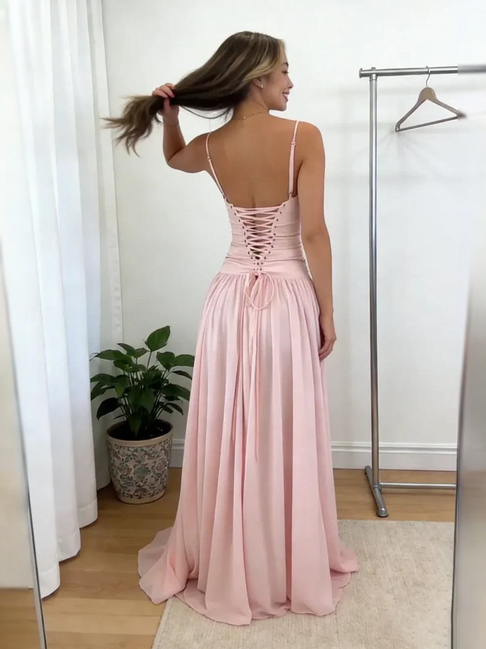 Pink backless prom dress with crisscross corset back and flowing chiffon A-line skirt