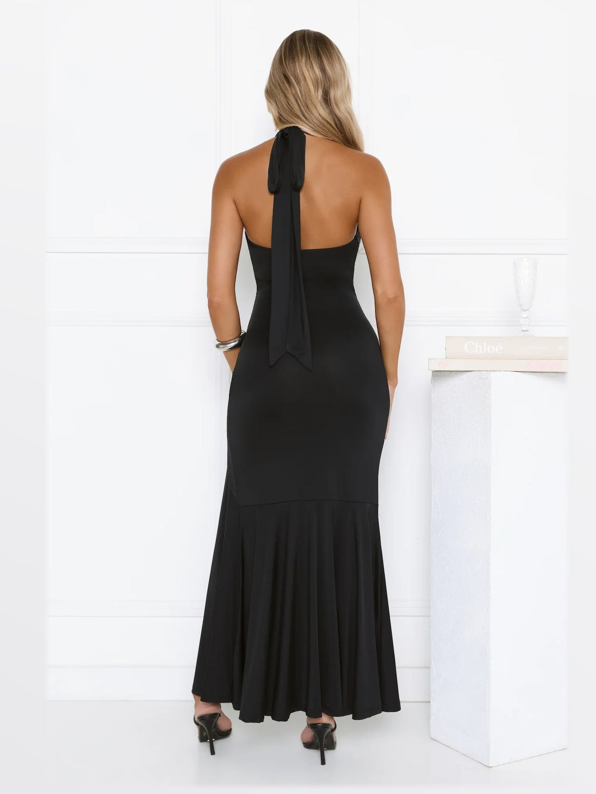 Black maxi formal dress, back full-length view showing the bodice
