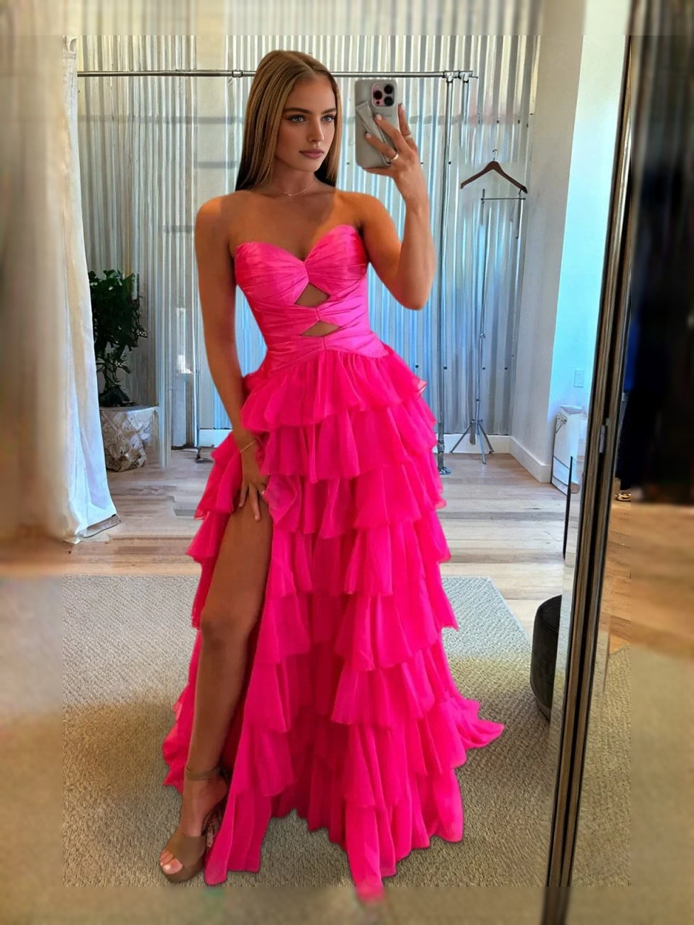 Hot pink strapless sweetheart ruffle prom dress with corset cut-out bodice and slit