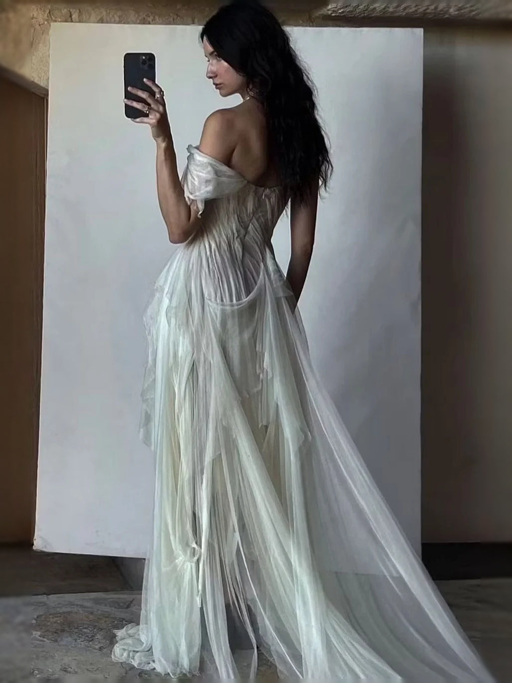 Sage green sweetheart prom maxi dress, side view with draped layers and long slit