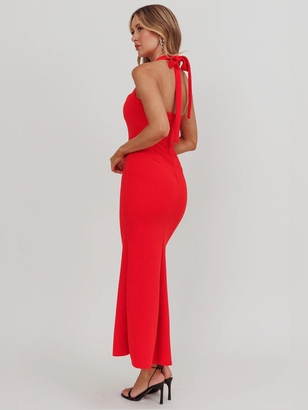 Red sheath maxi formal dress with open back, full-length back view