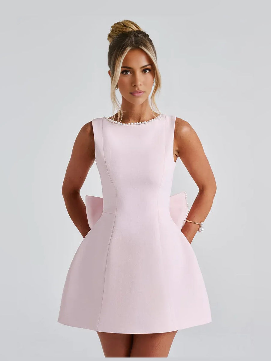 Blush pink sleeveless mini formal dress with beaded neckline and A-line skirt