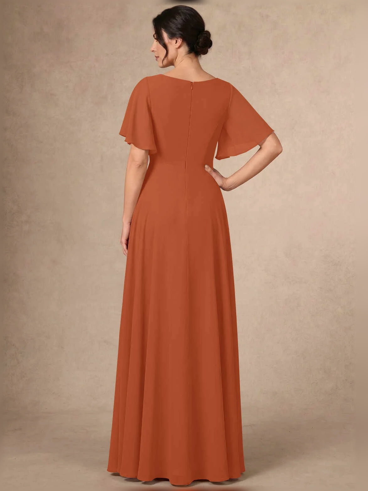 Burnt orange sequin A-line maxi chiffon dress, back view with flutter sleeves