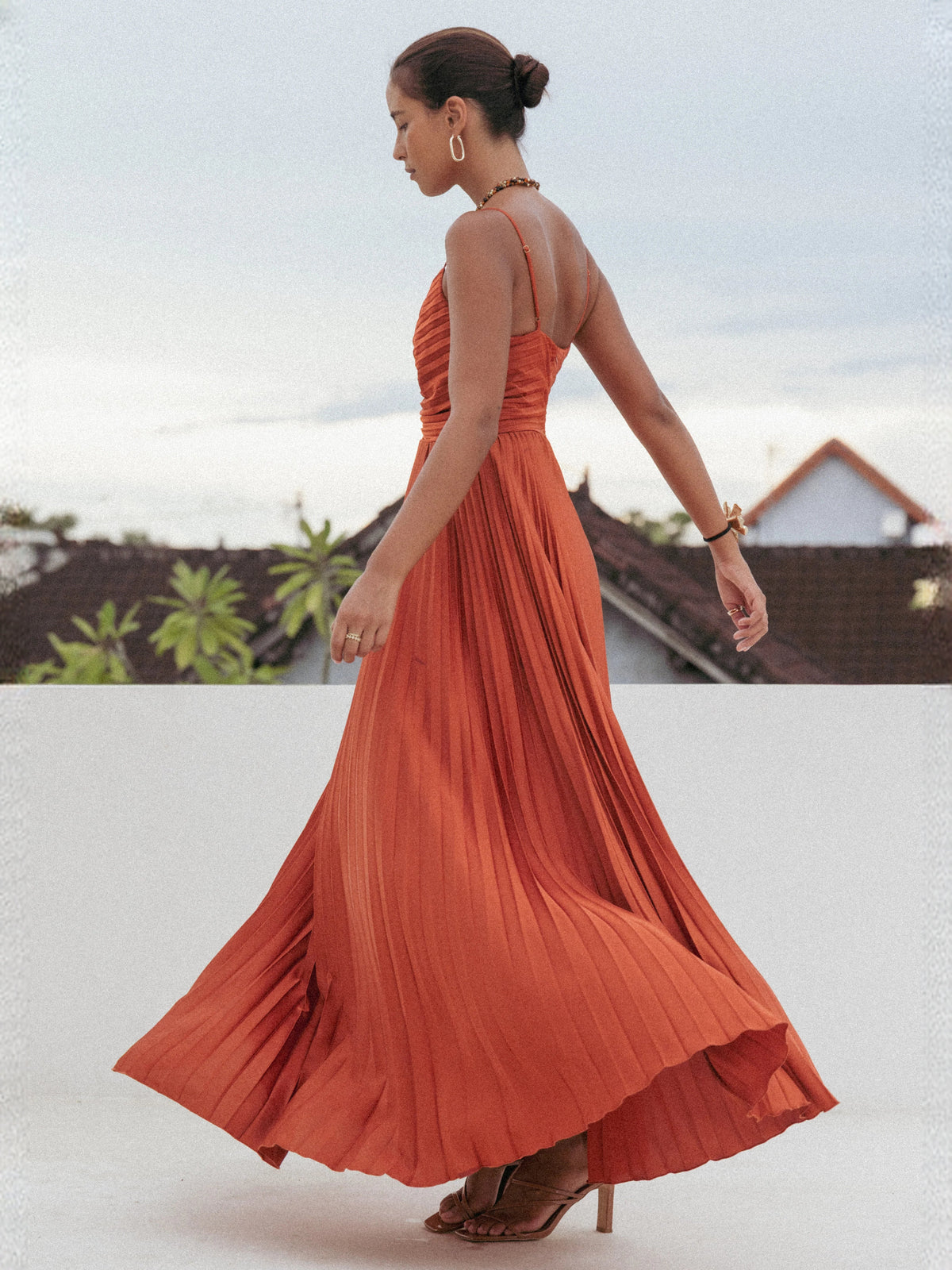 Orange pleated maxi dress with ruched bodice and spaghetti straps (back)