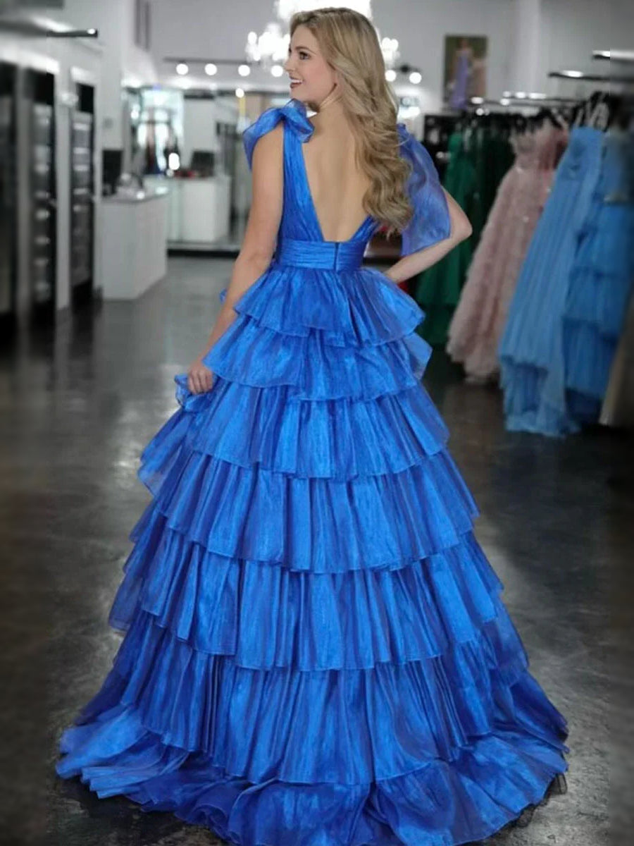 Royal blue tiered ruffle V-neck A-line maxi tulle prom dress, side view with shoulder ties