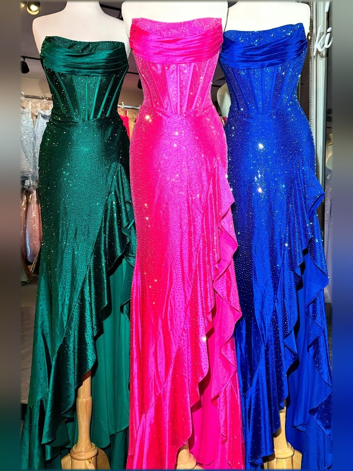 Sparkly mermaid formal dresses in dark green, hot pink, and royal blue with front slits.