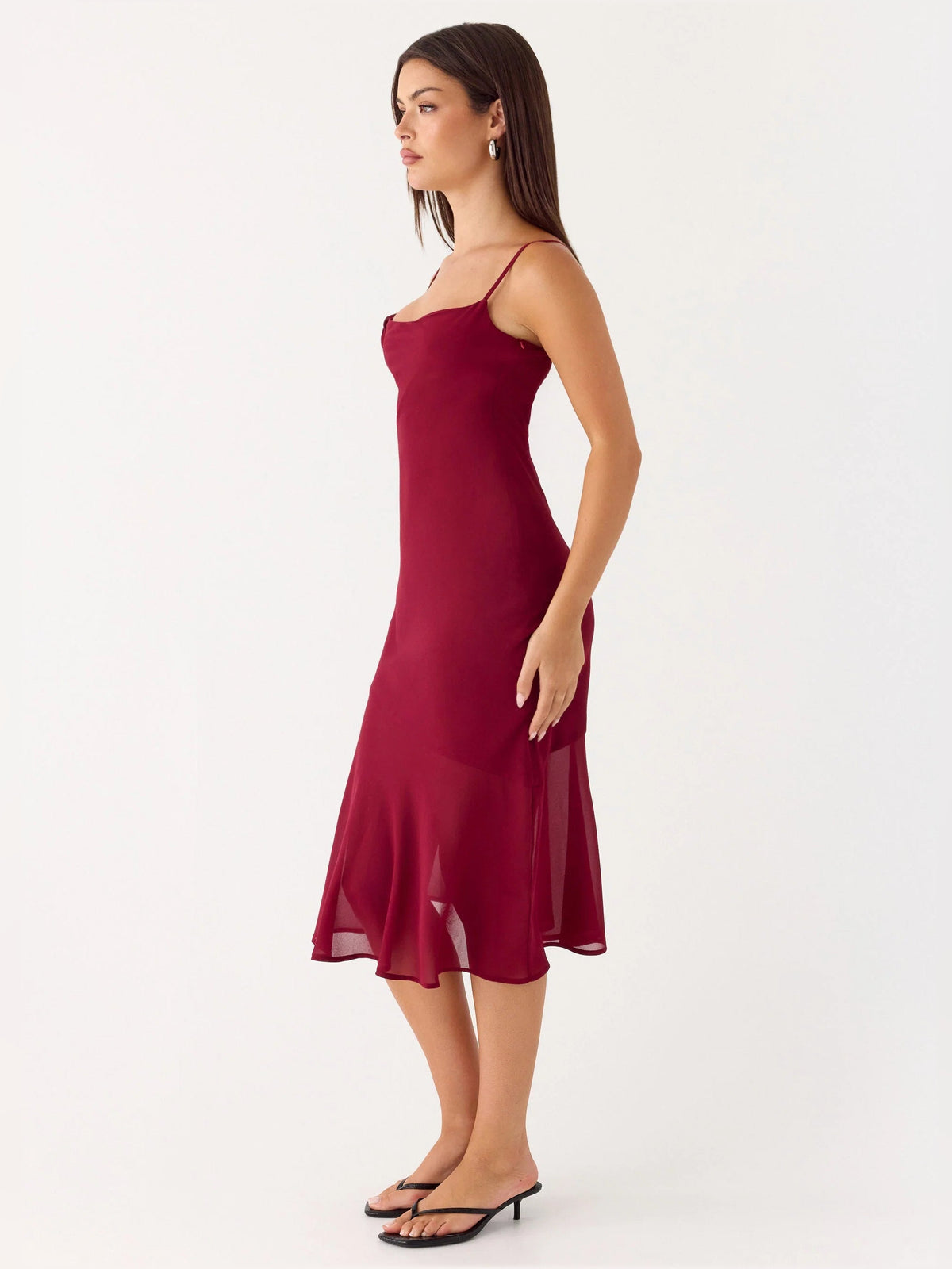 Red midi formal dress with thin straps and fitted waist, flared skirt hem