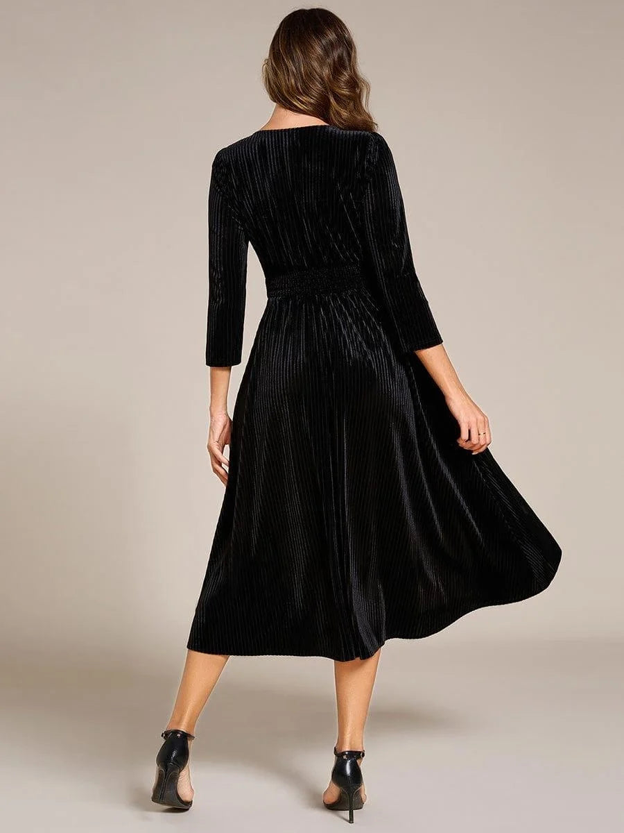 Black velvet V-neck A-line midi dress, back view with long sleeves