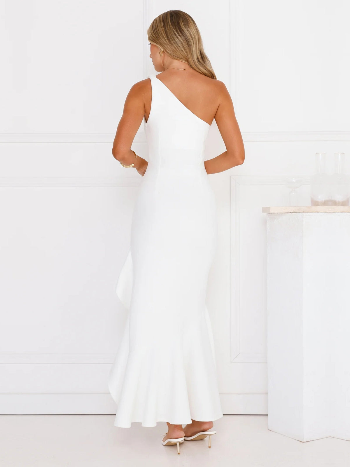 White sheath maxi formal dress with skirt slit, full-length back view