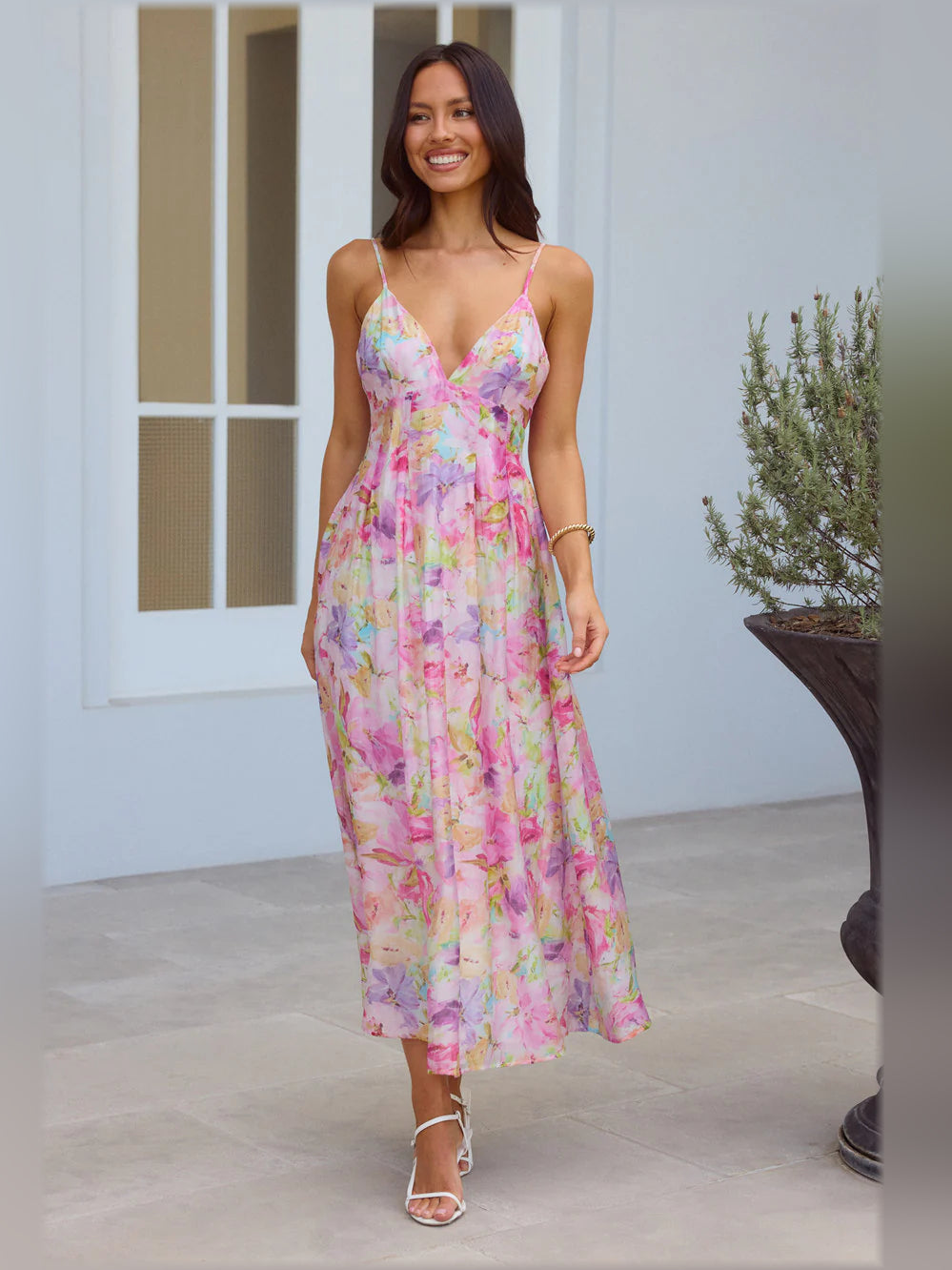 Multicolor floral print midi dress with V-neck and spaghetti straps, flowing skirt