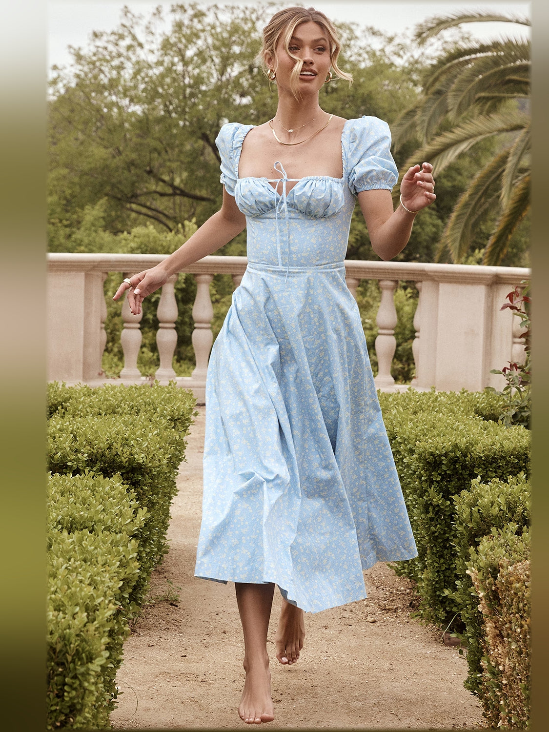 Light blue floral midi dress with puff sleeves, square neckline, lace-up ruched bodice