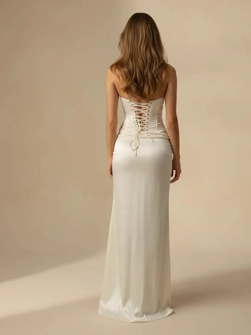 Ivory strapless satin wedding dress with ruched corset back and lace-up ties, slit