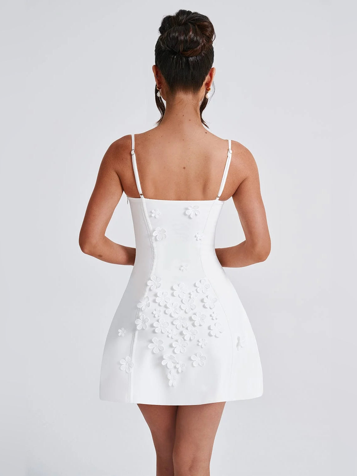 Ivory mini dress, spaghetti straps, back view with floral lace detailing