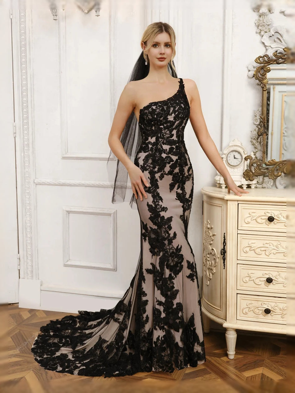 Black one-shoulder mermaid wedding dress with floral lace bodice and long tulle skirt