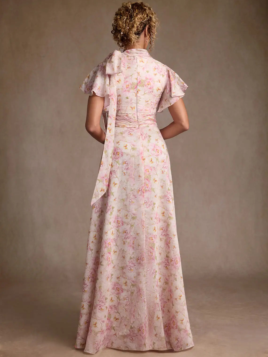 Floral chiffon maxi dress from back view, high neck, ruffled sleeves, pleated A-line skirt