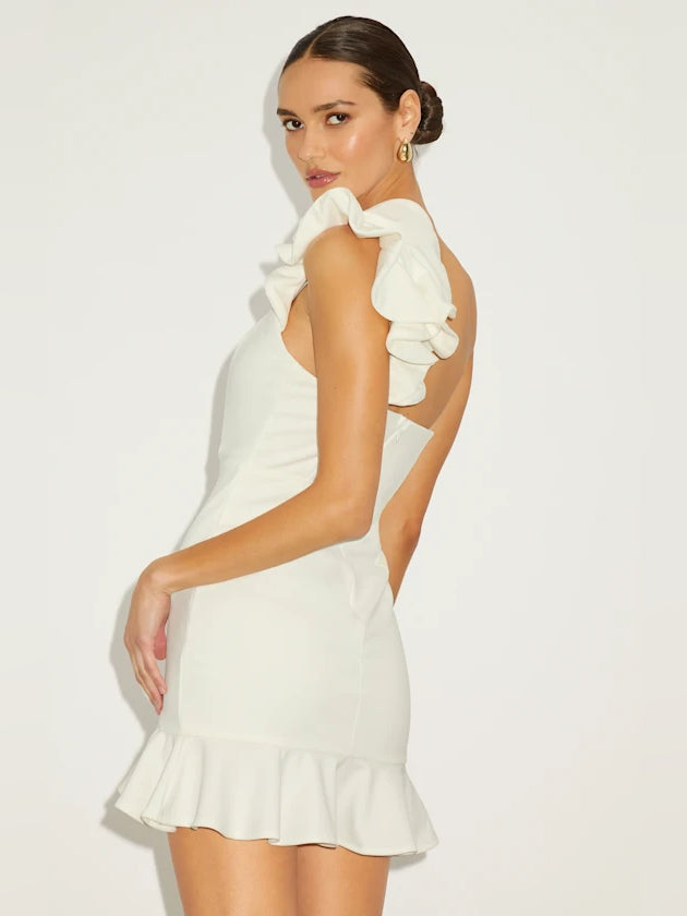 White one-shoulder mini dress, ruffled shoulder cape and tiered hem