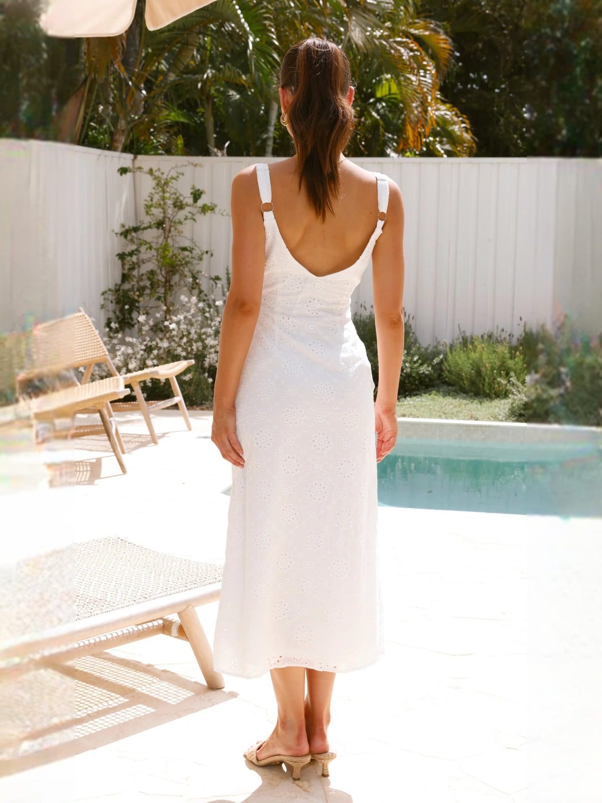 White midi formal dress, back view with thin straps and lace texture