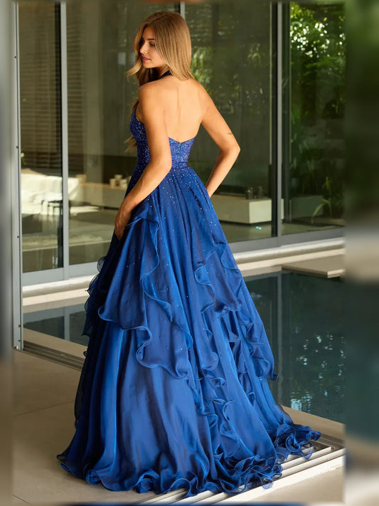 Back view of dark blue halter neck ruffle floor-length formal dress