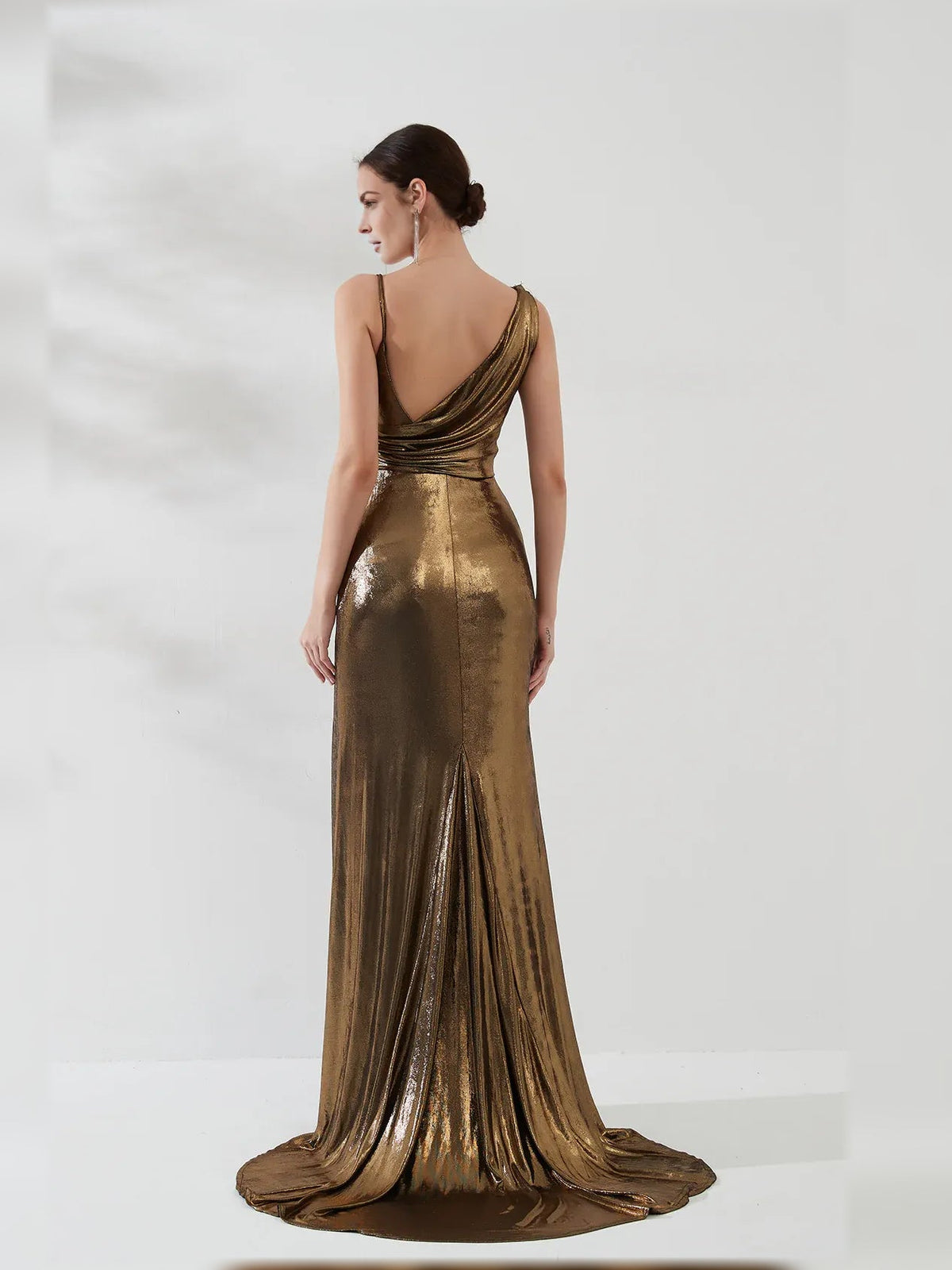 Gold one-shoulder satin mermaid gown, back view with draped neckline and slit