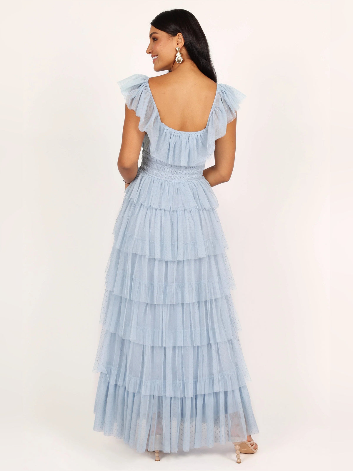 Blue a-line maxi formal dress with tiered skirt, full-length back view