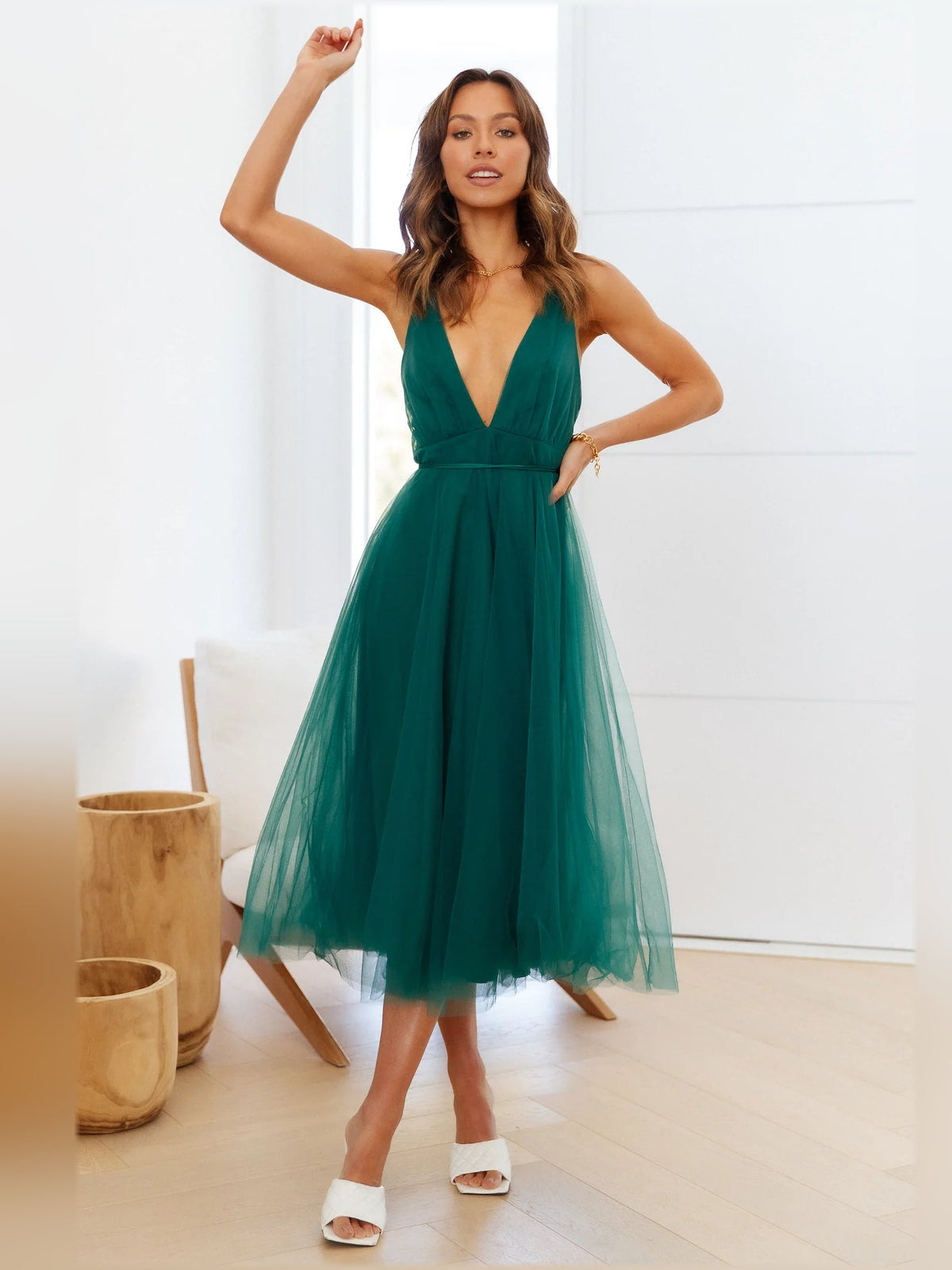 Forest green midi formal dress with V-neck halter straps and layered tulle skirt