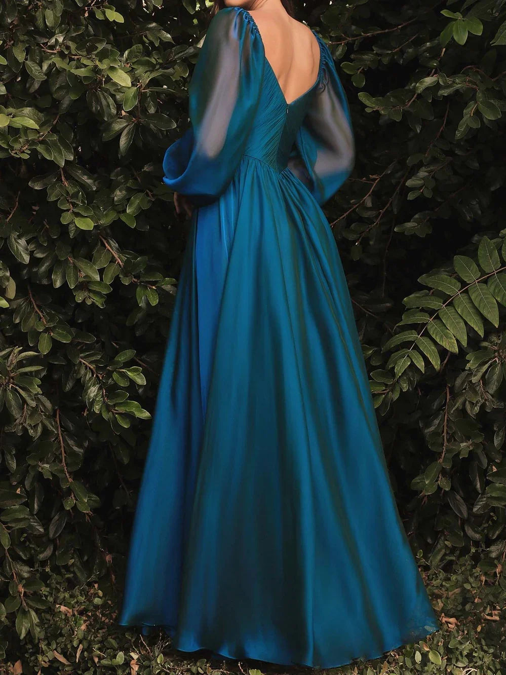 Teal long-sleeve A-line formal dress from back view with V-neck and gathered waist