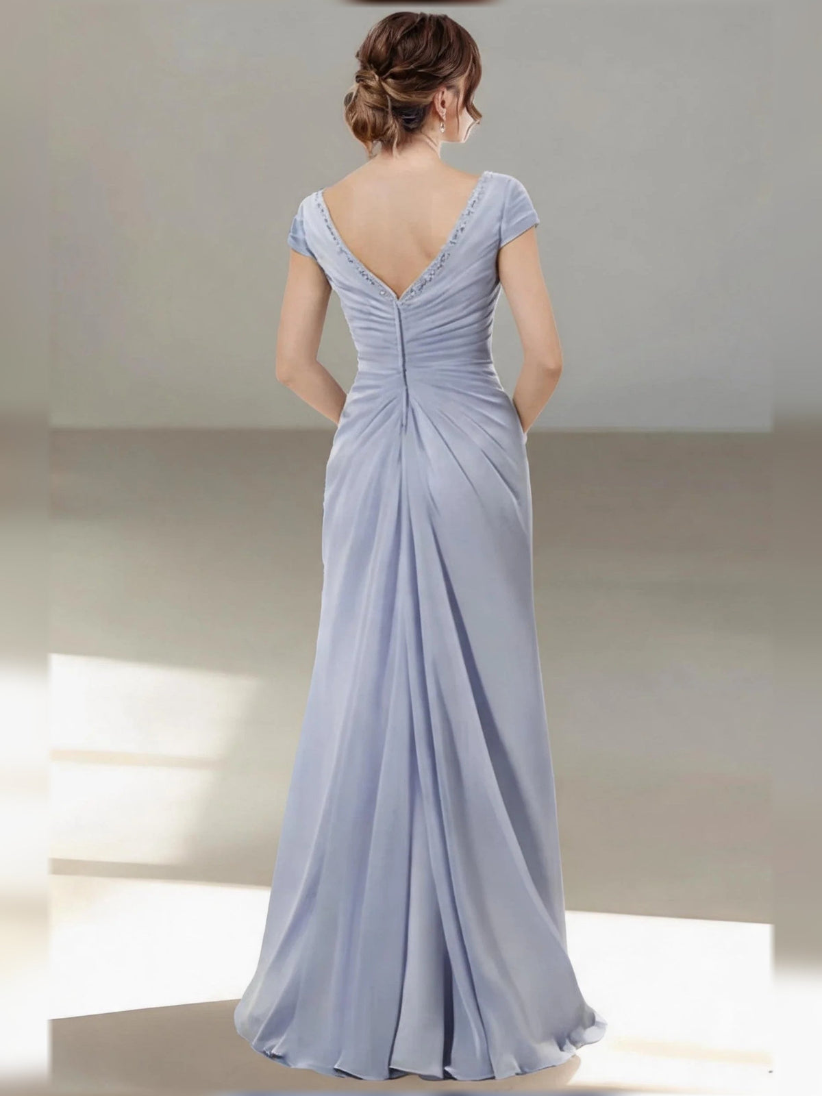Light blue V-neck ruched backless mermaid gown with cap sleeves and draped ruffle skirt