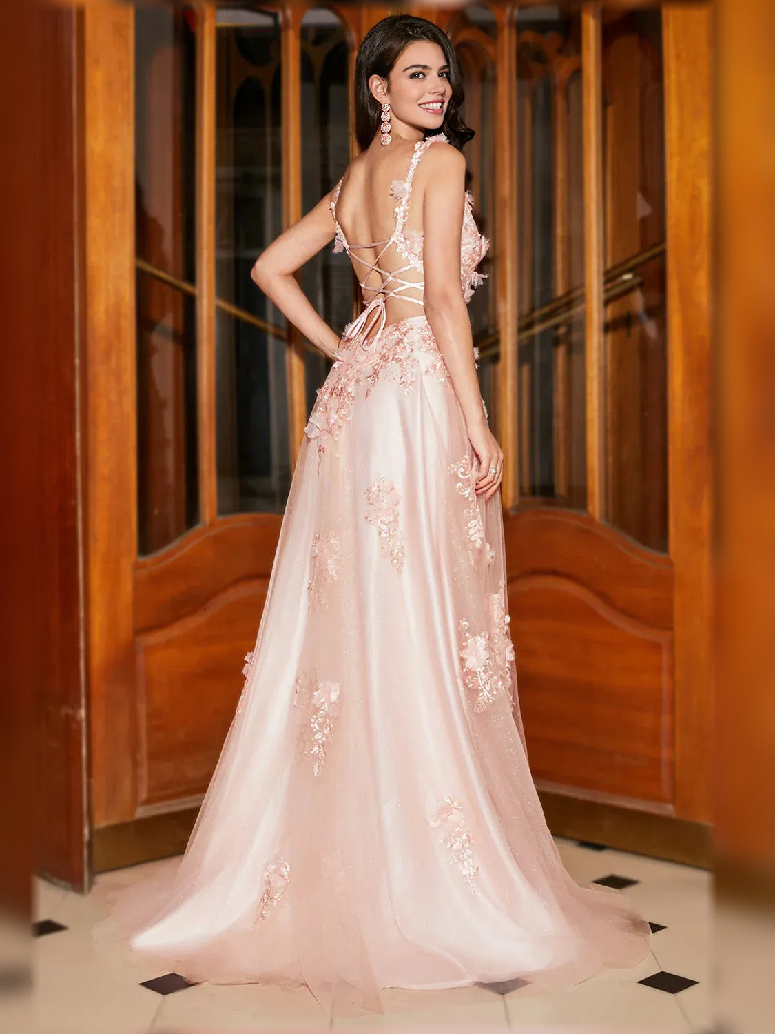 Light pink floral formal gown with V-back, sleeveless lace appliques, flowing A-line skirt