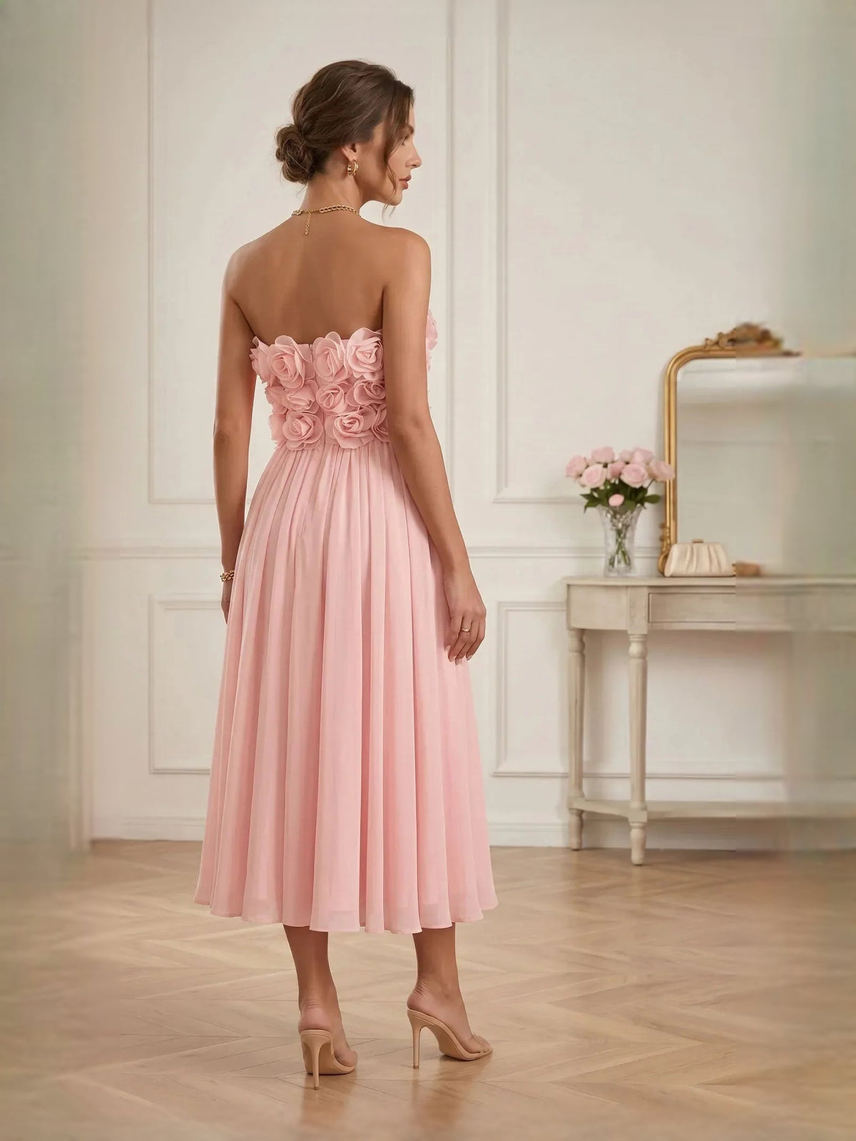 Floral strapless A-line midi chiffon dress in pearl pink, back view with rose applique