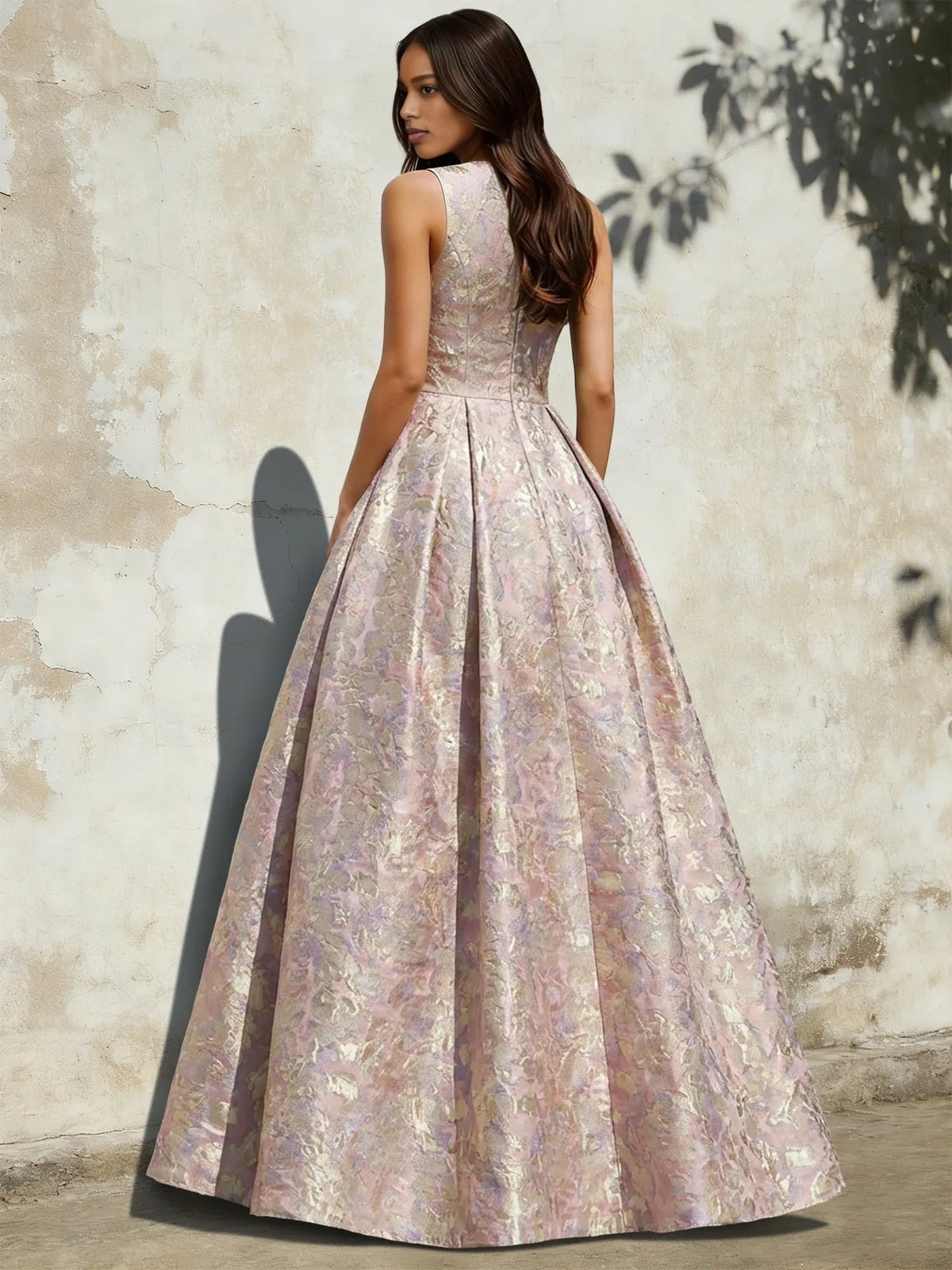 Pink floral A-line prom dress, side view; V-neck sleeveless with pleated skirt
