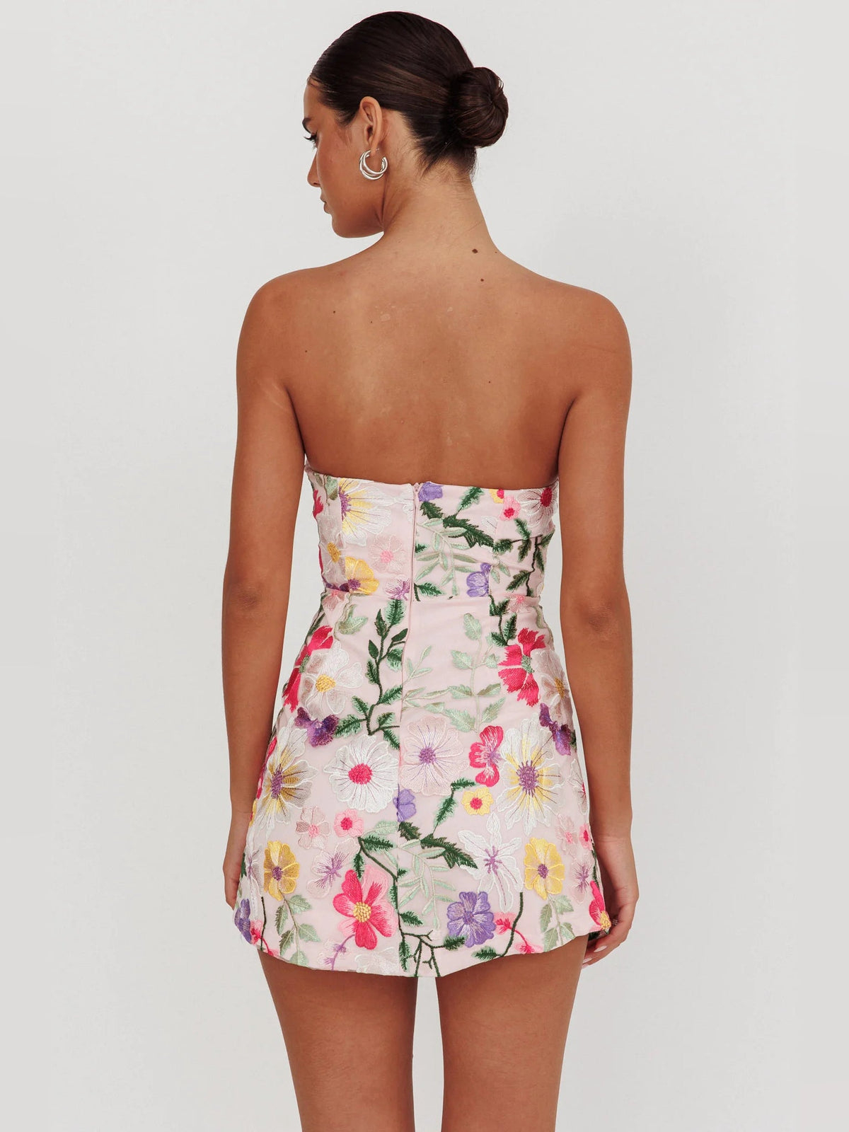 Back view floral strapless mini dress with corset-style seam detail