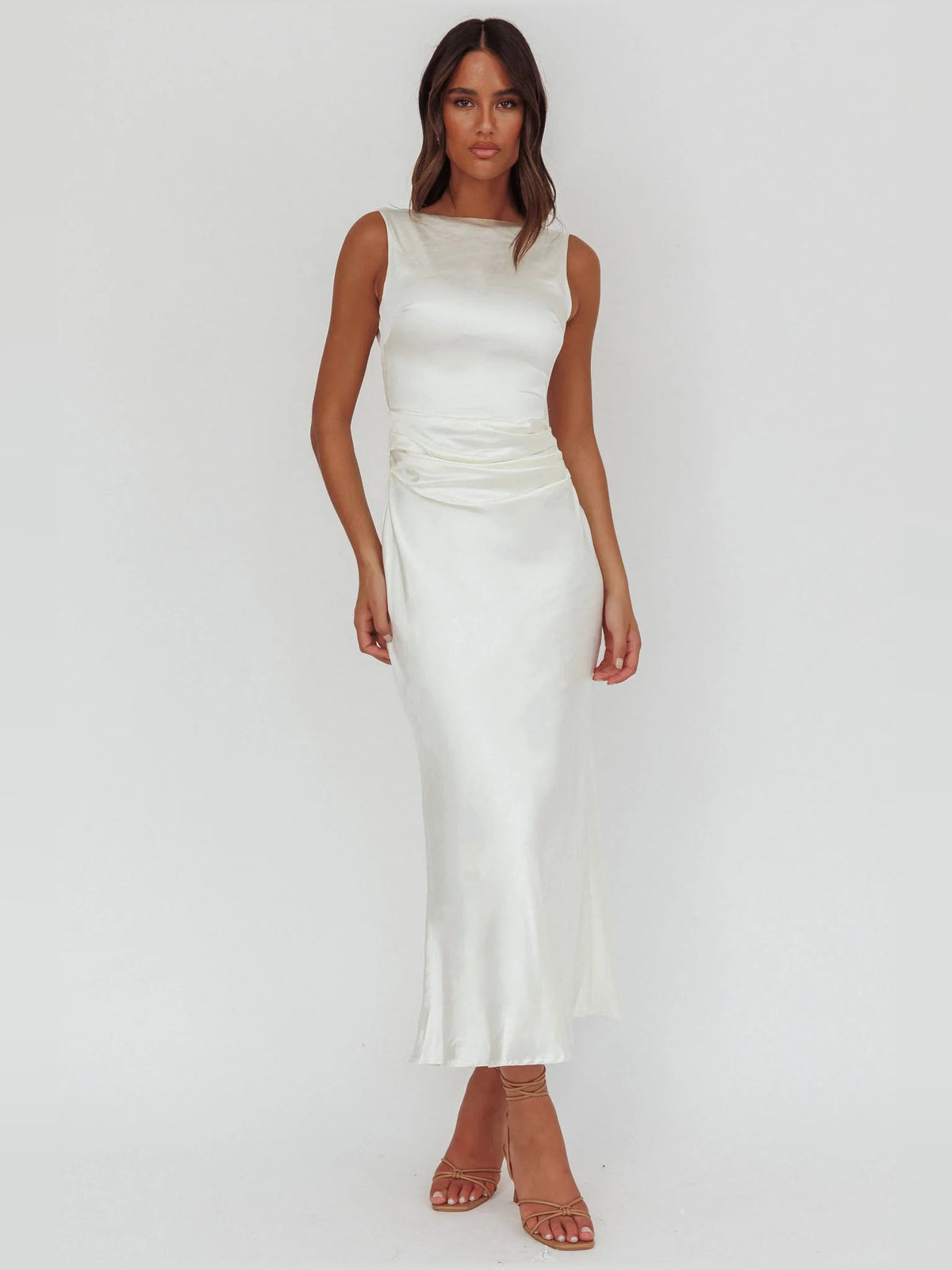 White sleeveless ruched midi formal dress with fitted silhouette and draped waist
