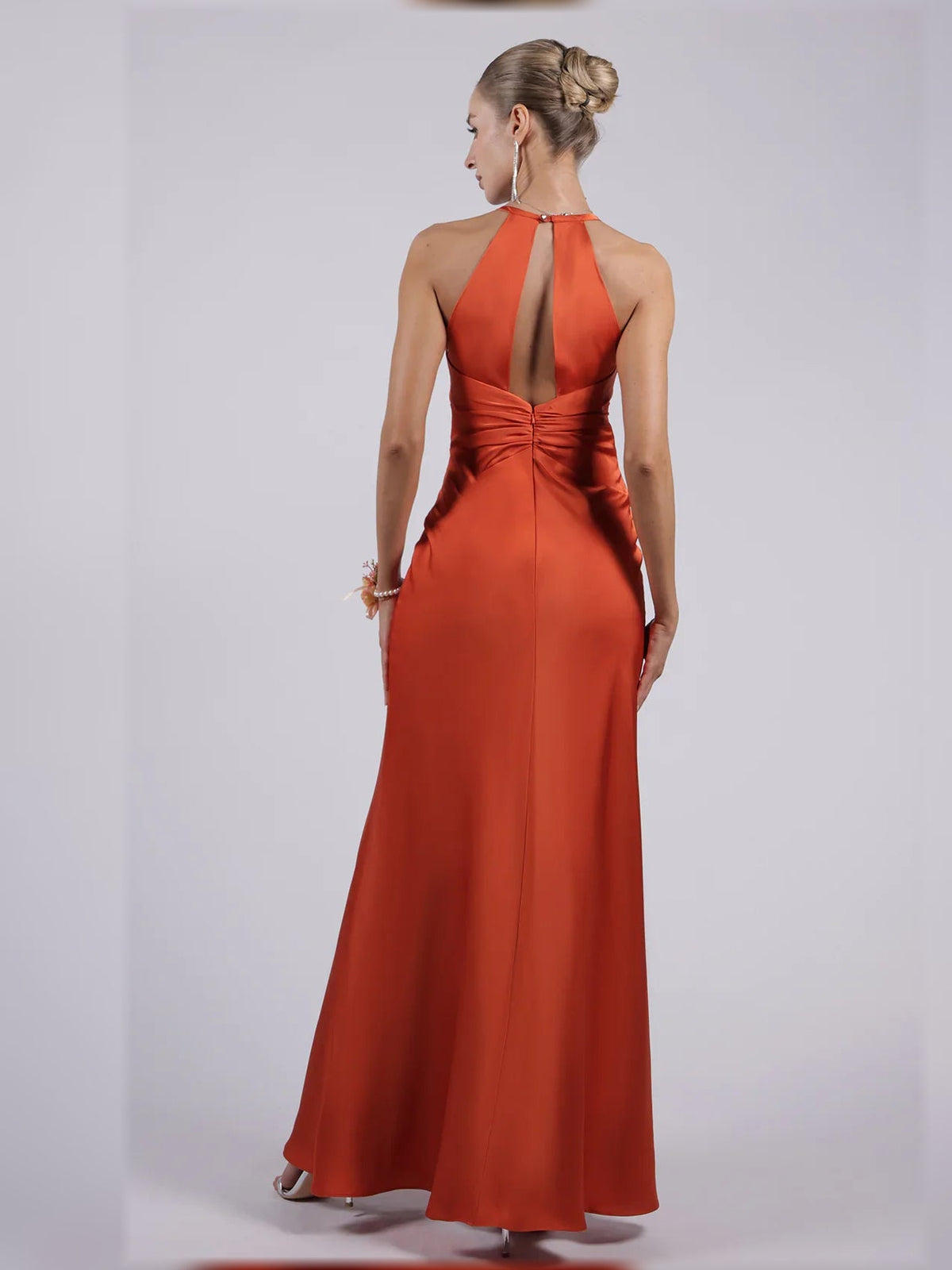 Burnt orange halter neck satin sheath formal dress with open back, floor-length