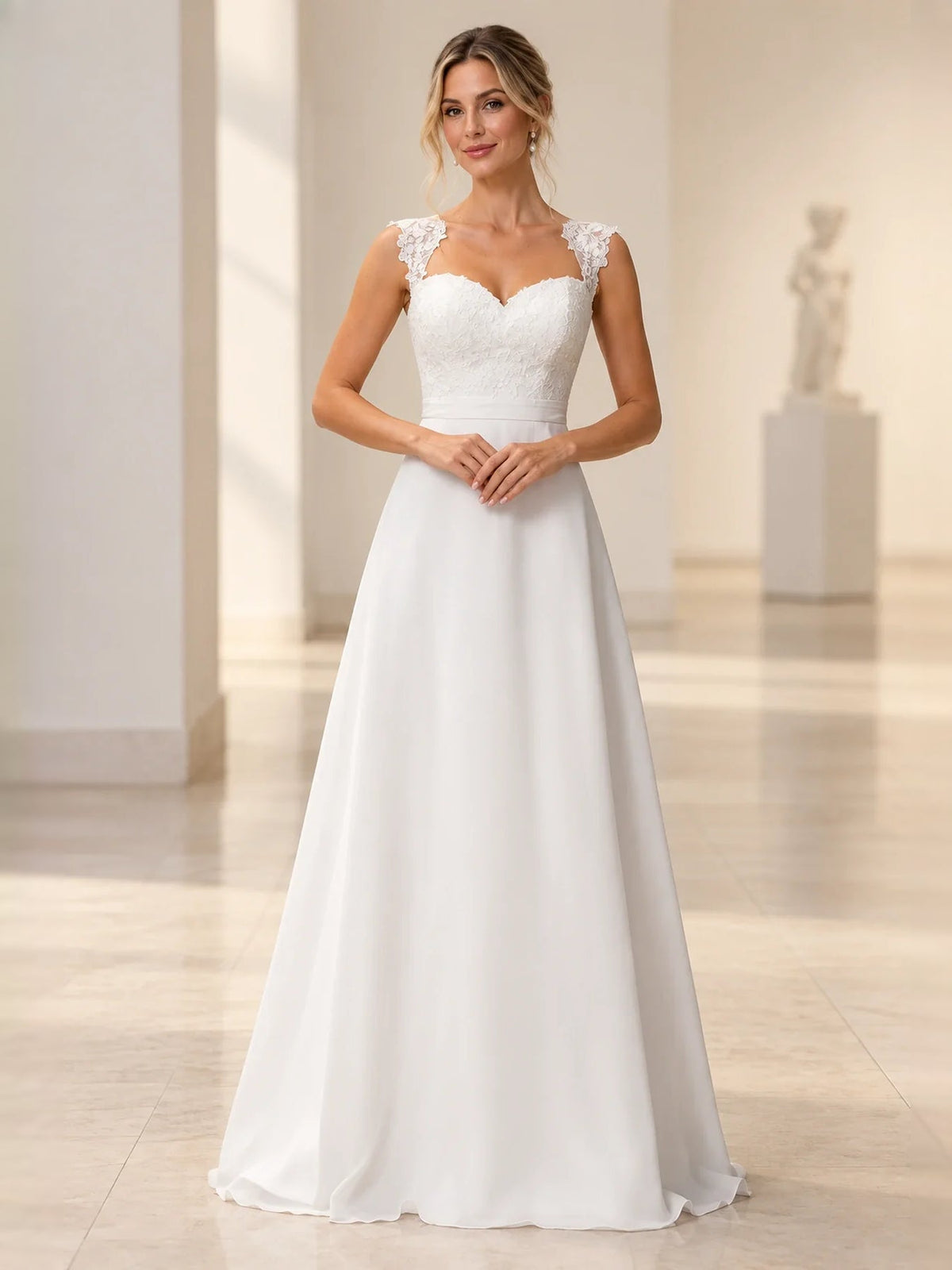 White satin A-line wedding dress with sweetheart neckline and lace shoulder details