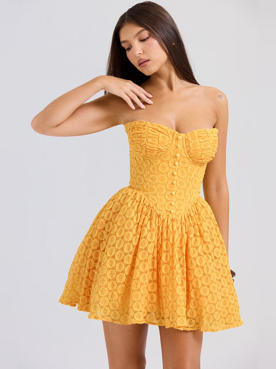 Apricot corset mini dress with sweetheart bodice, textured pattern, flared skirt