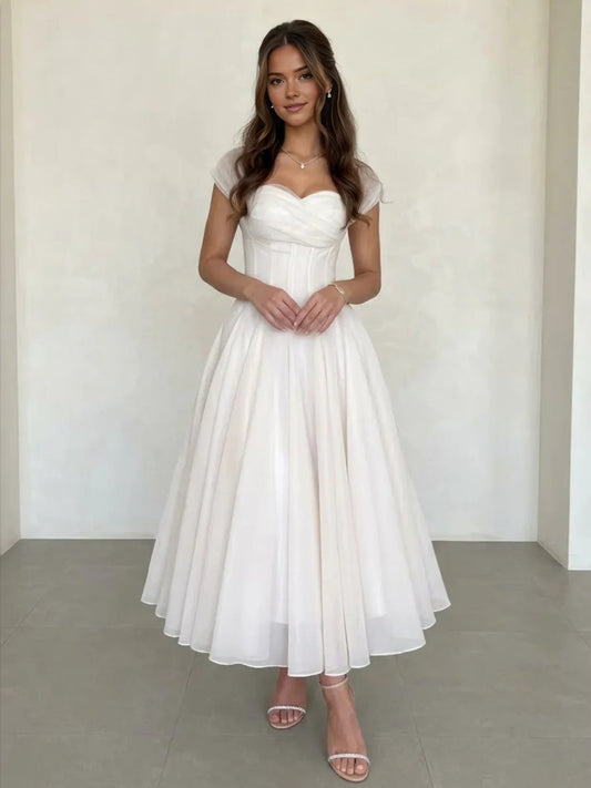 Ivory pleated sweetheart A-line tea-length chiffon wedding dress