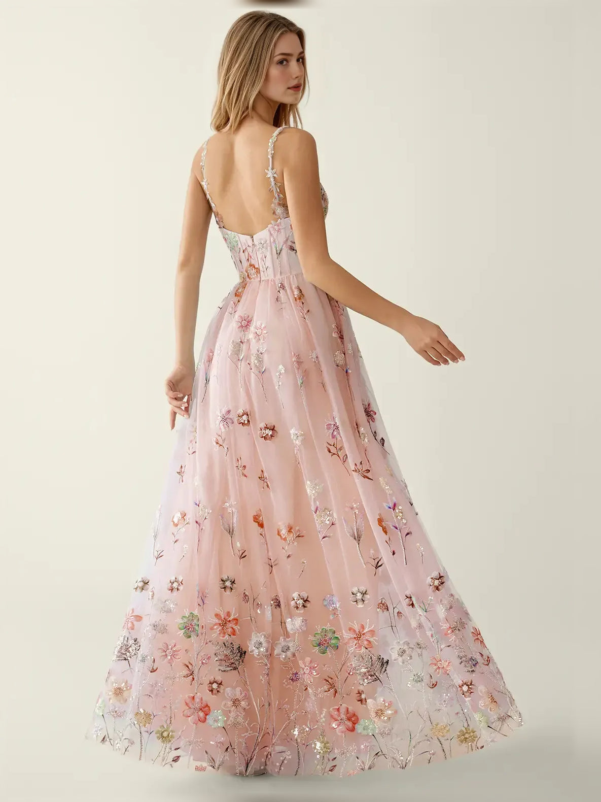 Blush pink floral sequin fit-and-flare formal dress, side view with thin straps