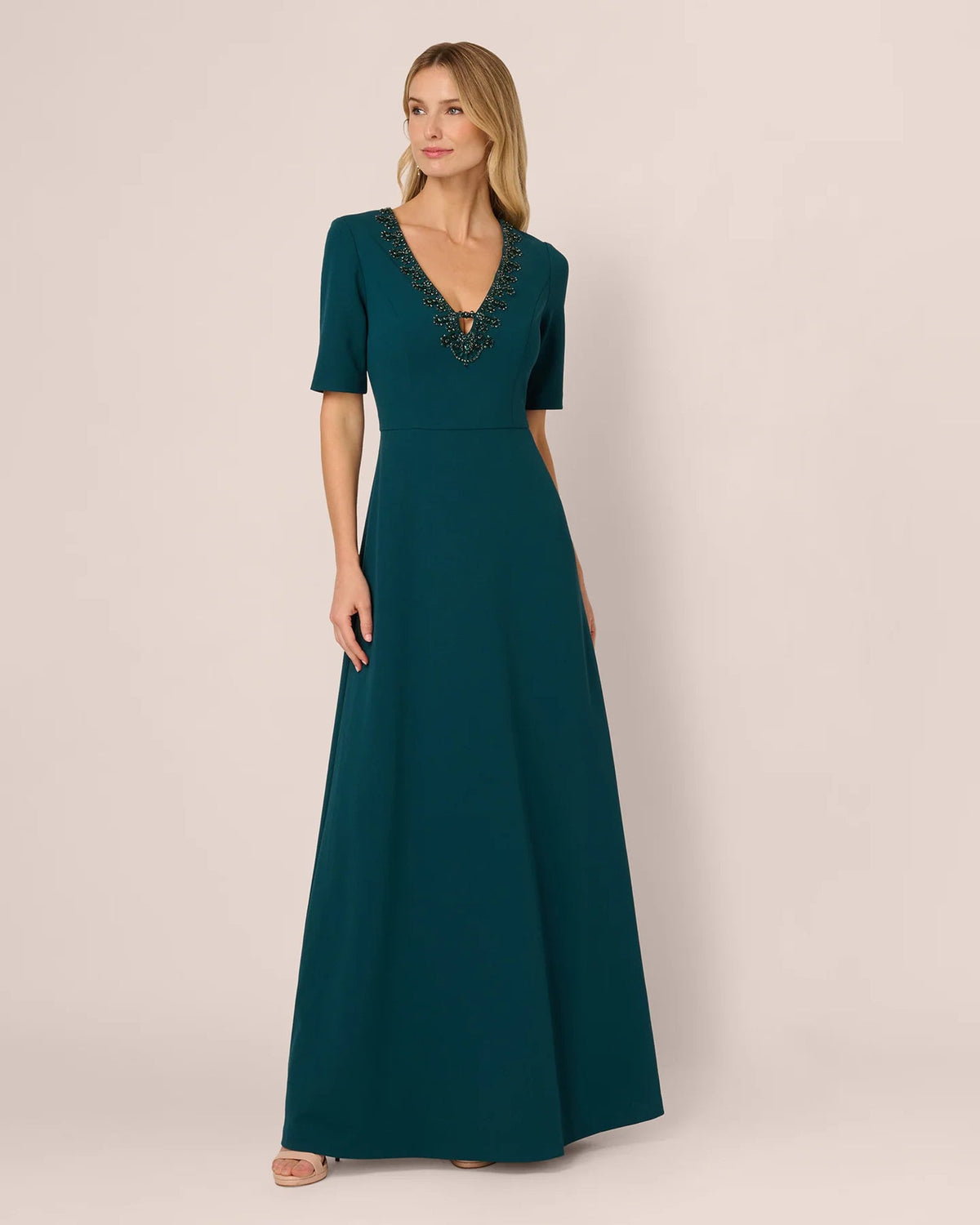 Teal A-line maxi dress with V-neckline and short sleeves, fitted bodice