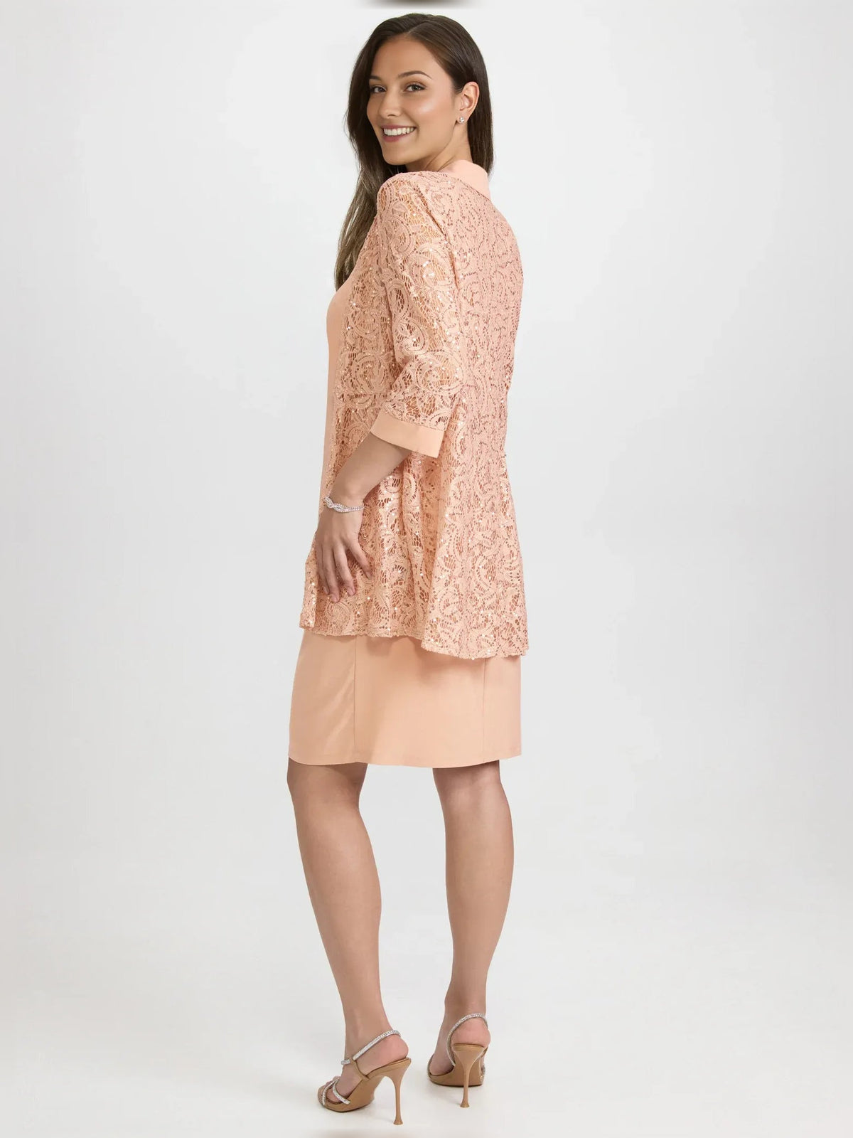Pearl pink halter neck midi jersey dress, side view with lace overlay sleeves