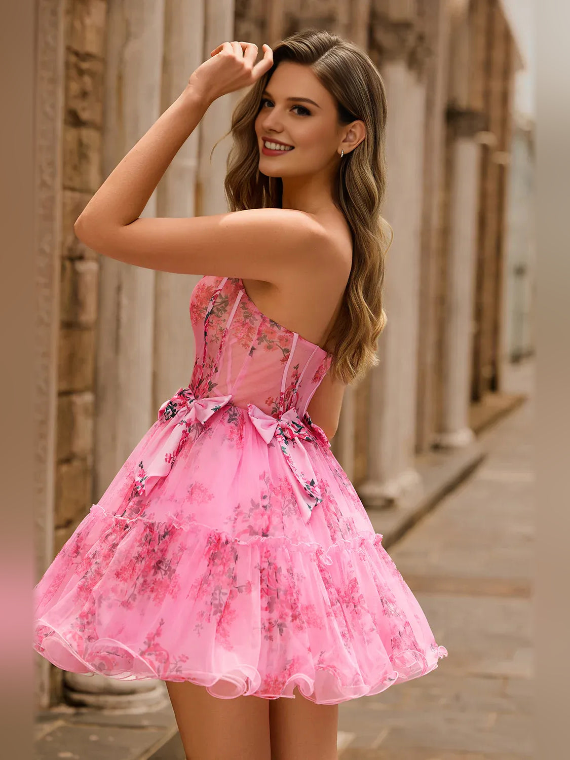 Pink floral strapless corset mini tulle dress, side view with bow detail