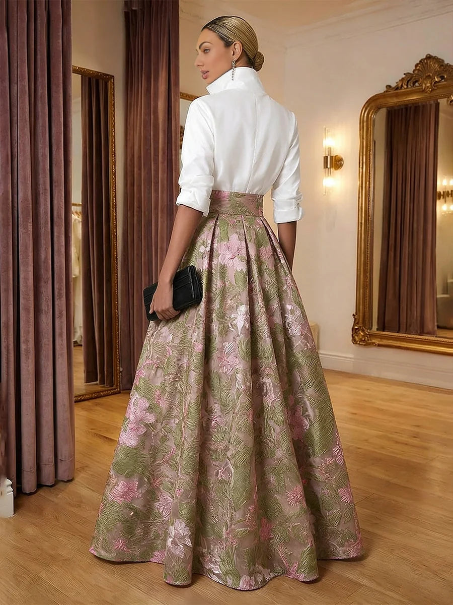 Back view: high-neck white top and pleated pink-and-green floral A-line skirt