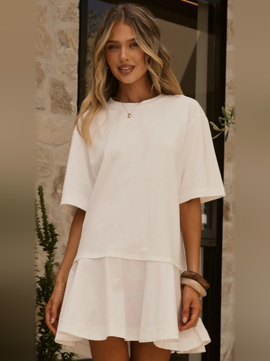 Off-white mini dress with short sleeves, layered tiers, small keyhole neckline