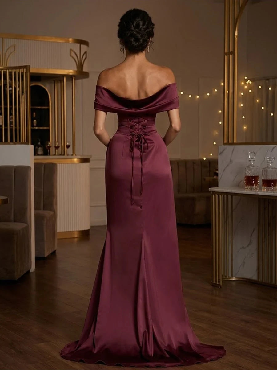 Burgundy off-the-shoulder corset maxi dress, back view with gathered waist and slit