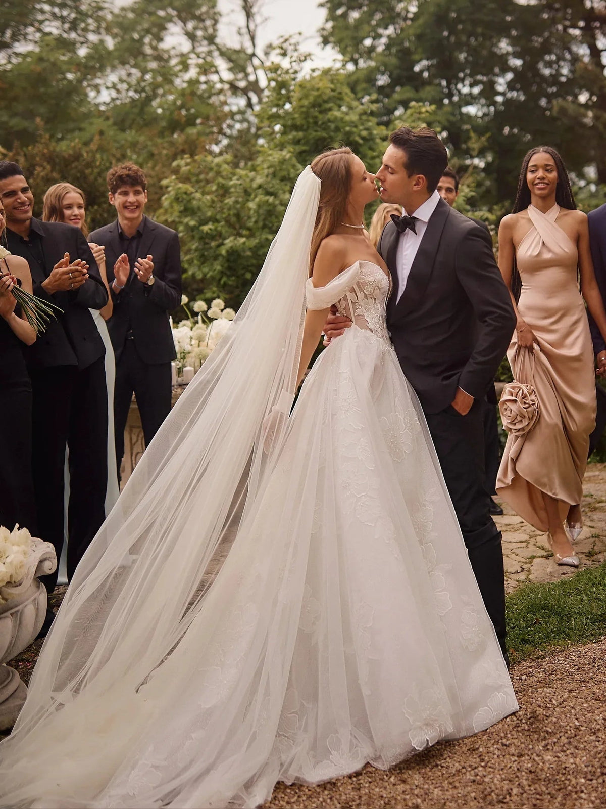 Ivory A-line wedding dress with corset bodice and long flowing tulle skirt