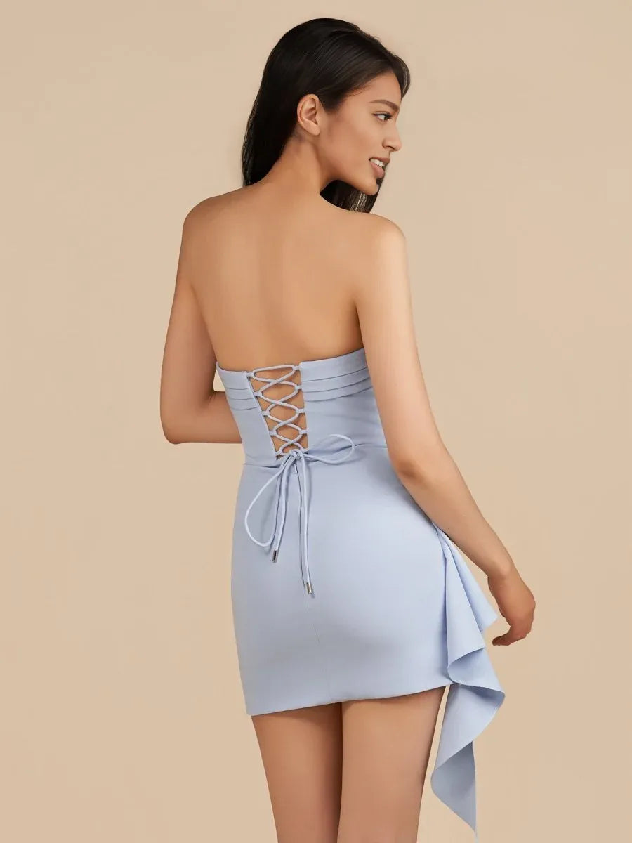Light blue strapless mini dress with ruched bodice, lace-up back, and ruffle hem