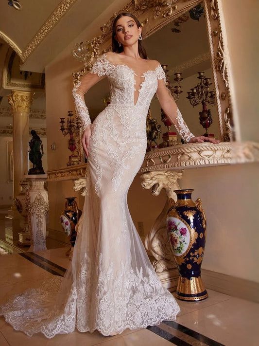 Ivory lace mermaid wedding dress with deep V neckline and long train