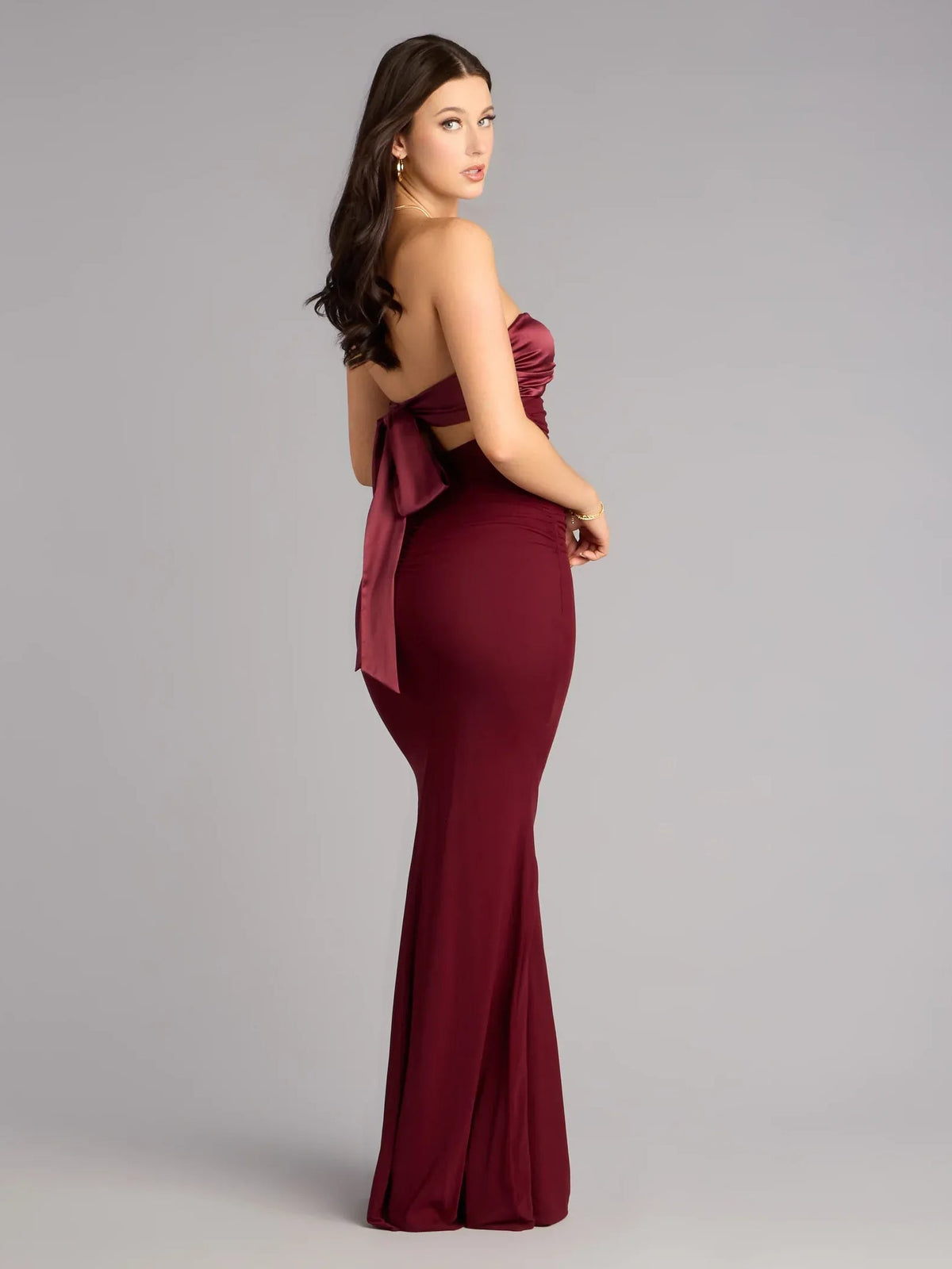 Wine strapless open-back floor-length dress with ruched sides and bow detail