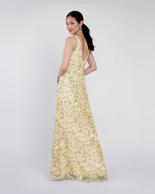 Yellow floral A-line maxi dress, V-neck sleeveless, side view