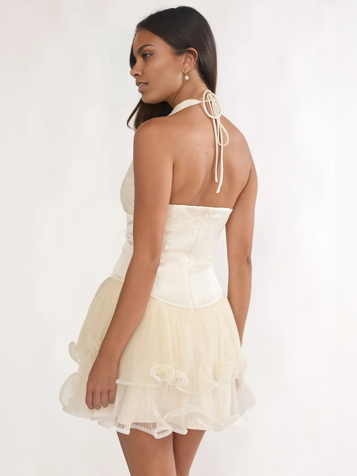 Ivory V-neck corset mini dress, layered ruffle hem, tie-back straps in back view